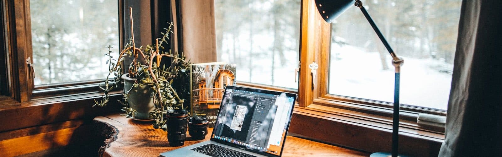 Laptop and notebook on a desk
